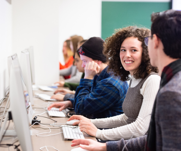 Students in Journalism computer lab. 