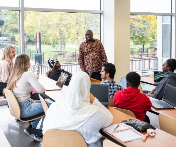 African Studies professor and students in a classroom.