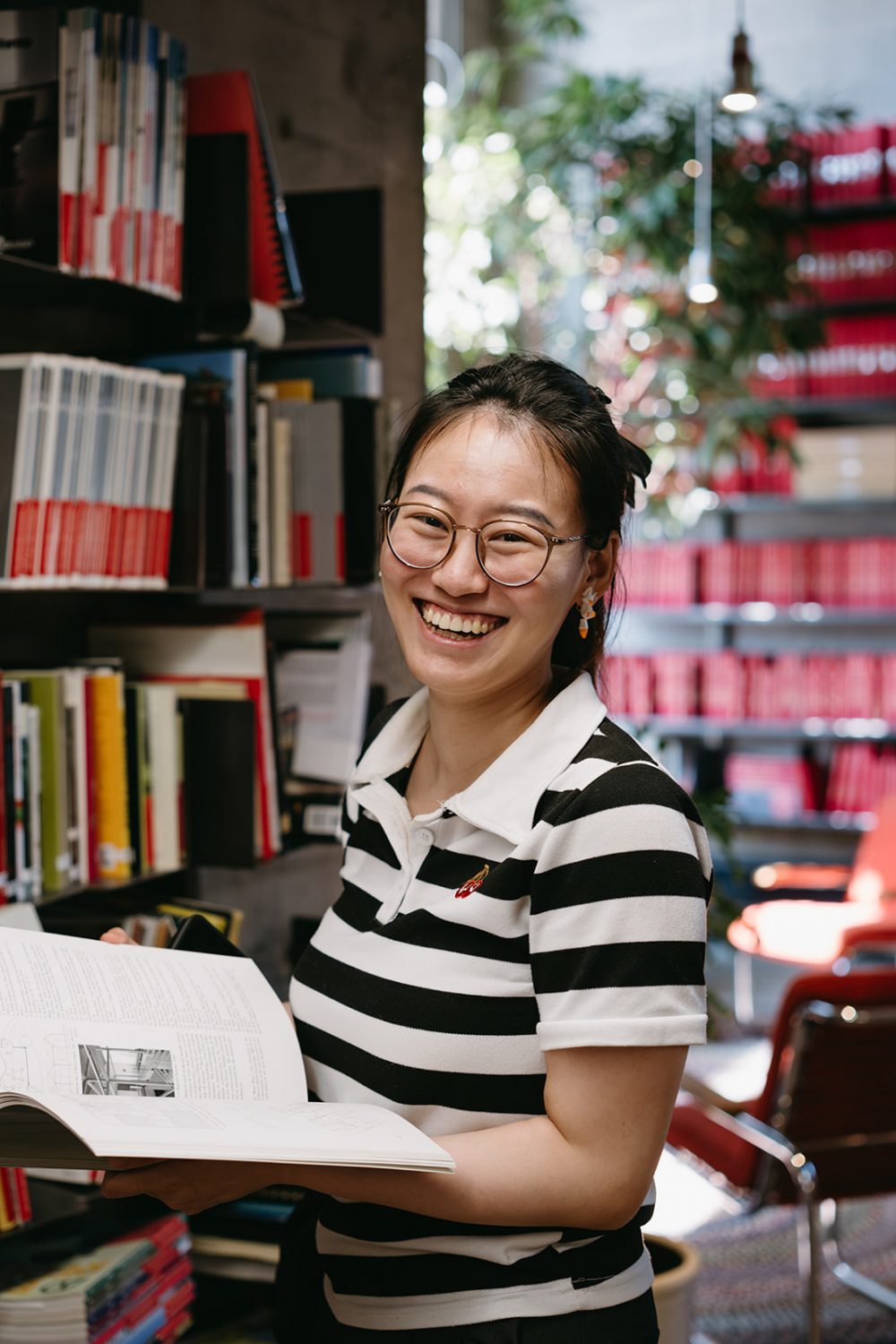 Carleton Faculty of Engineering and Design Lab Student with a book