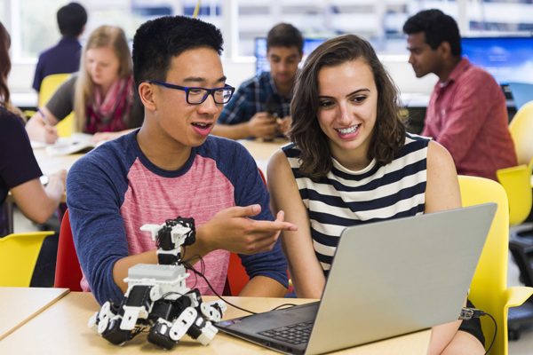 Students working with a robot