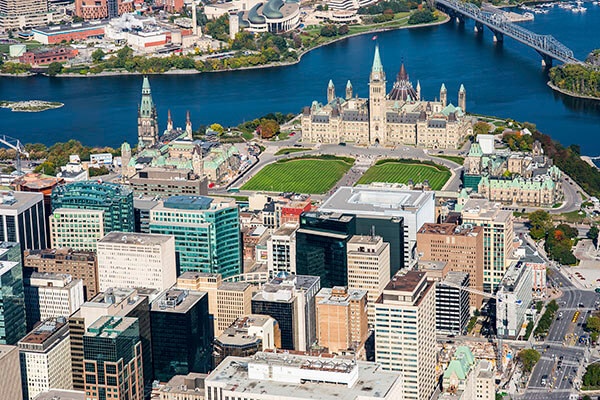 An aerial image of downtown Ottawa and the Parliament buildings