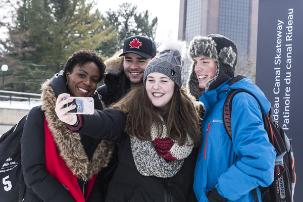 Group of students taking a photo on the Rideau Canal